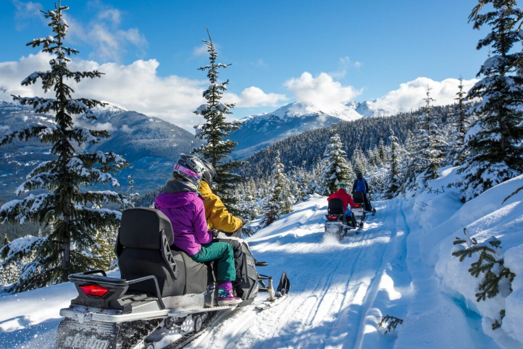 Couples on Snowmobile with The
Adventure Group, Whistler CR Tourism Whistler/Claire Lang
