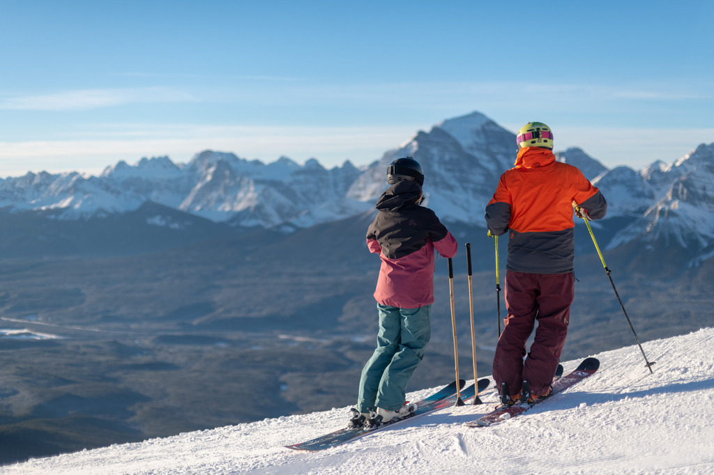 Winter couples ski at Lake Louise, one of Canada's top ski destinations