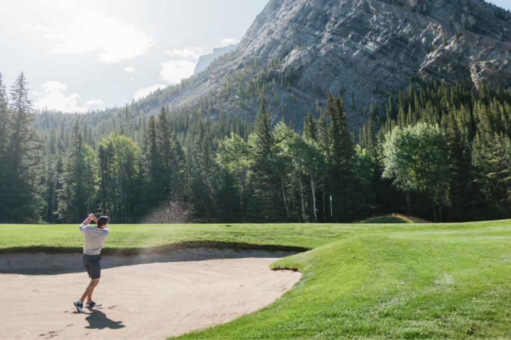 Fairmont Banff Springs Golf Course in the spring - Golfer in a sand bunker - Chris Amat