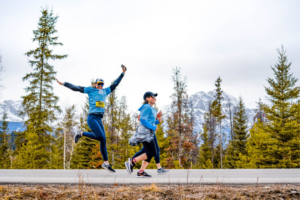 Three runners participating in the Jasper Half Marathon in Spring. Jasper National Park.