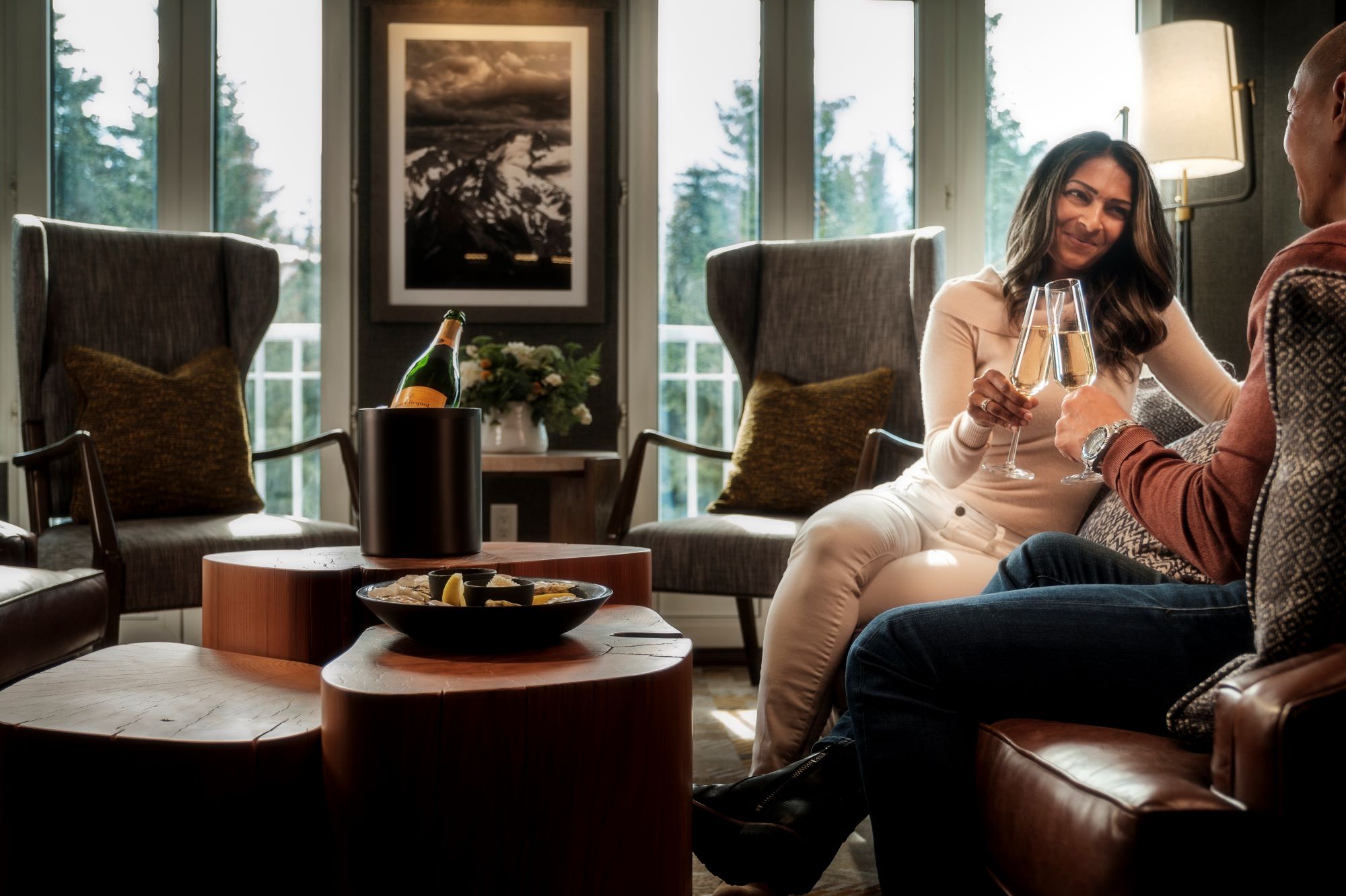 Whistler Luxury Hotels - Fairmont Gold - A couple toasting with Champagne at Fairmont Chateau Whistler