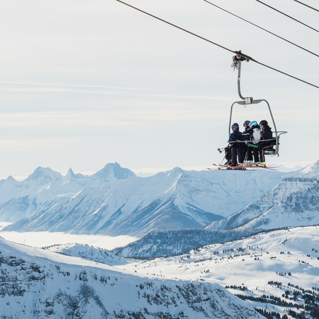 A group of friends on the chairlift at Banff Sunshine Villlage, photo by Kyle Mulde & Banff Sunshine Village, one of Canada's top ski destinations