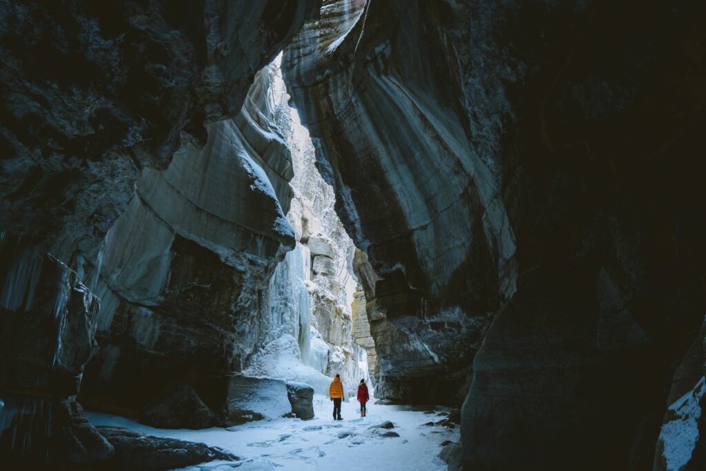 A couple on a  Romantic Icewalk tour through Maligne Canyon in Winter