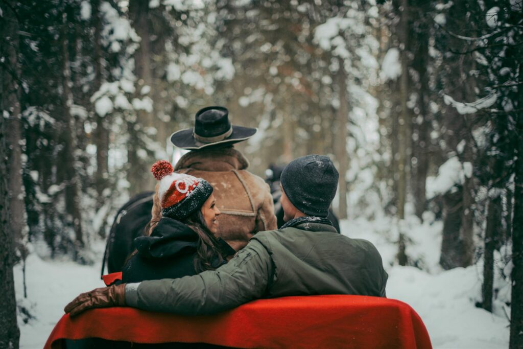 A couple on a horse-drawn sleigh ride around Lake Louise, photo by Travel Alberta / Célestine Aerden