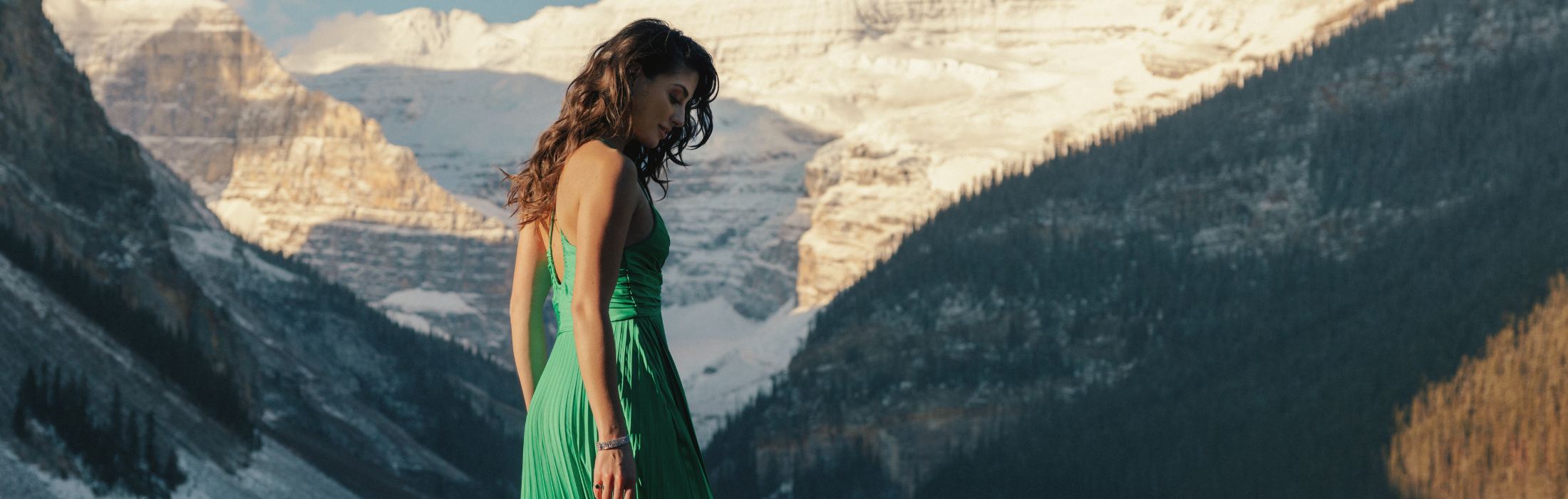 A women in green dress in Lake Louise - Experience Fairmont Moments in Lake Louise