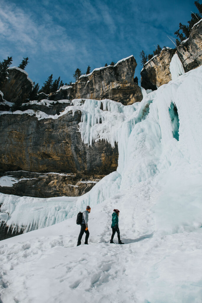 A couple ice walking Panther Falls, Alberta