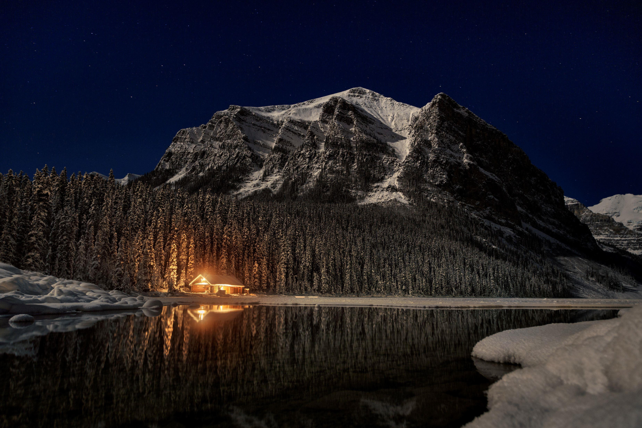Mountains under the starry night ski at Lake Louise in Banff National Park