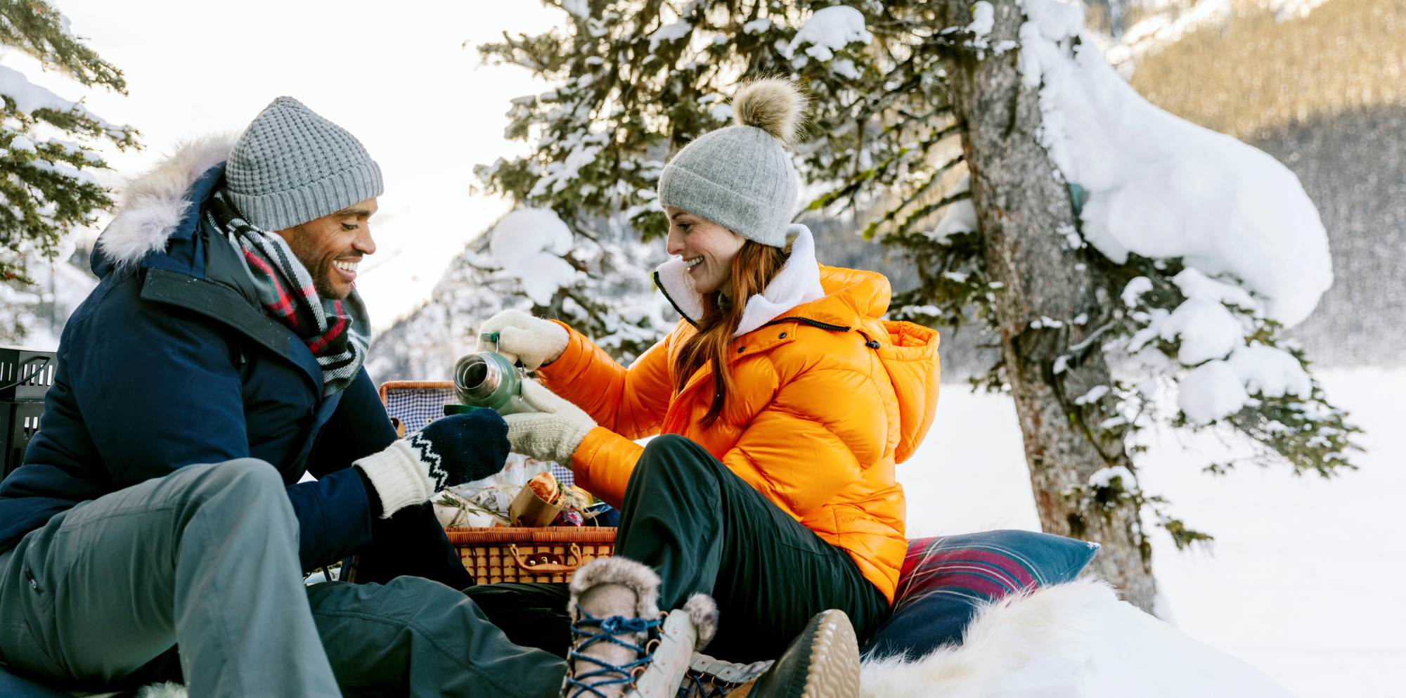 Couple having a picnic in the winter at Lake Louise